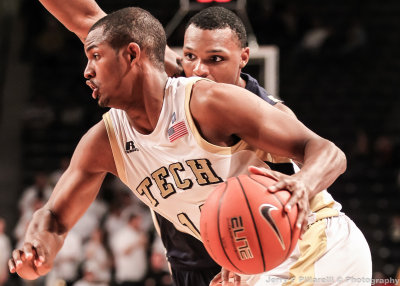 Yellow Jackets G Jason Morris drives by a Mocs defender 