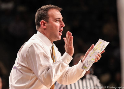 Chattanooga Mocs Head Coach John Shulman instructs his team from the sidelines