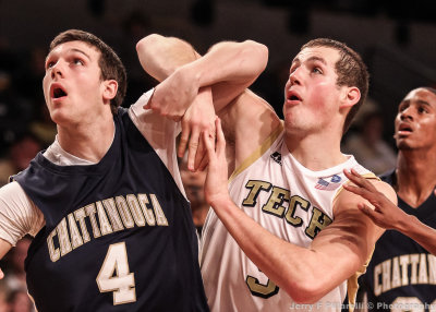 Georgia Tech C Miller jousts under the boards with Chattanooga F Watson