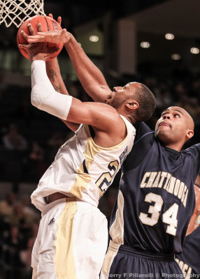 Yellow Jackets F Holsey is fouled in the act of shooting by Mocs F Bryant