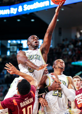 Jackets G Mufon Udofia scores over Hokies G Marquis Rankin