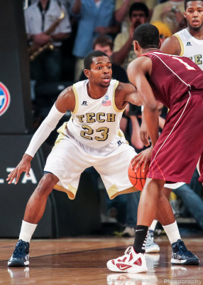 Yellow Jackets G Reed squares up on defense against Hokies G Adam Smith