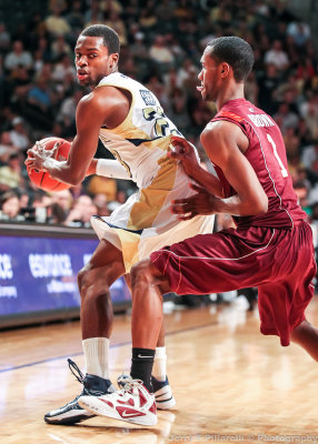 Georgia Tech G Reed looks for an opening with Virginia Tech G Brown defending