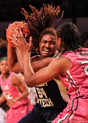 Tech F Roddreka Rogers keeps the ball out of reach from Hurricanes F Keyona Hayes