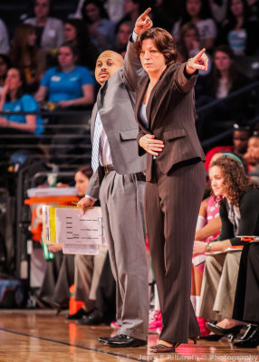 Miami Hurricanes Head Coach Katie Meier and Assistant Coach Darrick Gibbs instruct the team from the bench