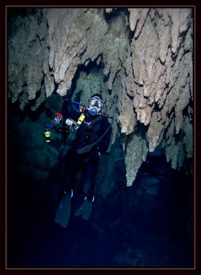 Susie trying to become one with the stalactites