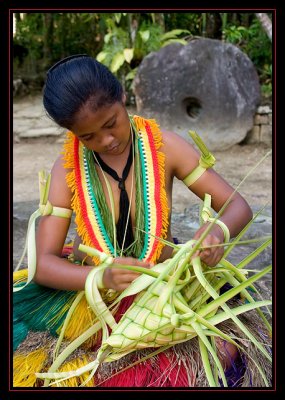 Yapese girl weaving a basket