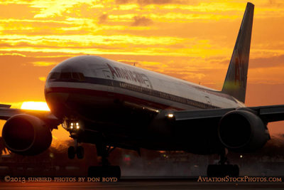 American Airlines B777-223ER N774AN landing on runway 9 at MIA at sunset aviation stock photo #3602