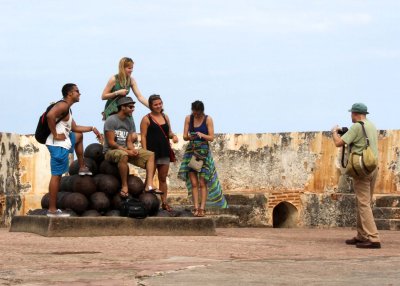Howard takes a picture of a group of tourists at El Morro 