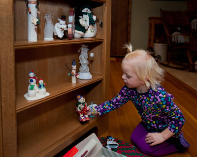 Grace helping arrange Grandma's snowmen