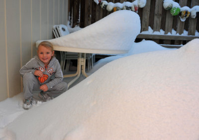 Macey showing the deep snow on our deck