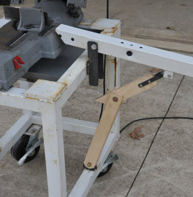 A light push up on the support bracket starts the folding process