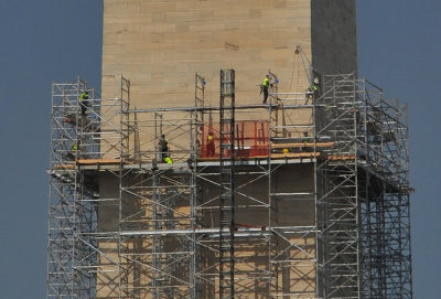 Workers repairing earthquake damage on the Washington Memorial (about 300' above the ground)