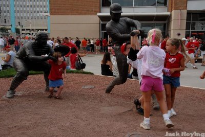 Playing with the statues in front of the Great American Ballpark