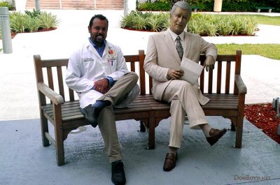 November 2012 - Suresh Atapattu with statue of Harcourt M. Sylvester Jr., namesake of the Sylvester Comprehensive Cancer Center