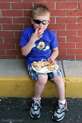May 2012 - Kyler enjoying a tasty treat at the Territory Days Street Festival in Old Colorado City