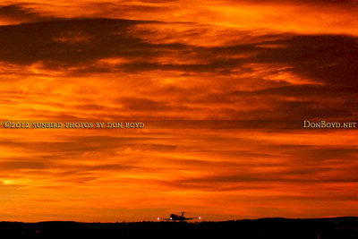 November 2012 - American Airlines MD-80 landing at Colorado Springs with sunset clouds in the background