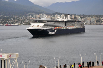 One of the Holland America dams backing up while a plane lands