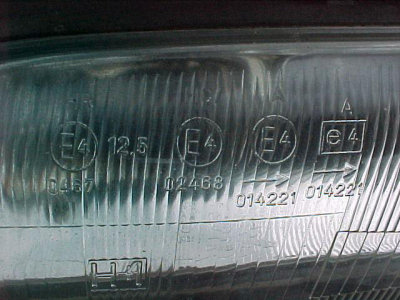 E markings on glass headlights