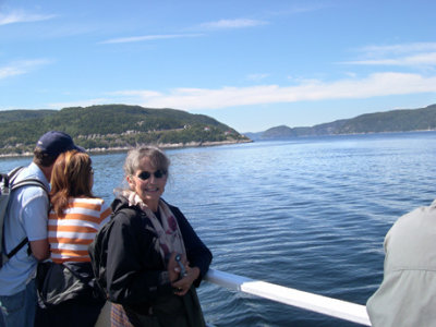 Judy on a boat on the St. Lawrence River heading to the whale watching areas.