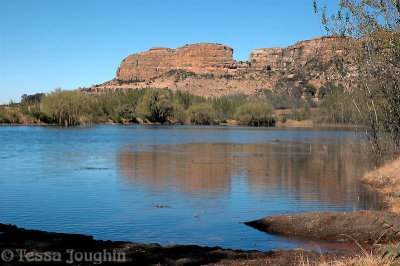 Sandstone cliffs over the water