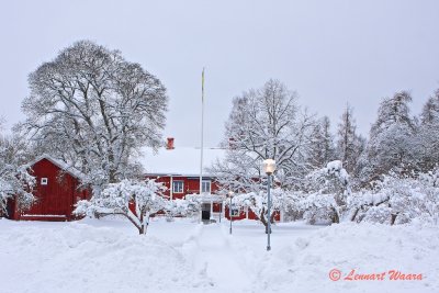 Traditional Swedish house in winter dress.