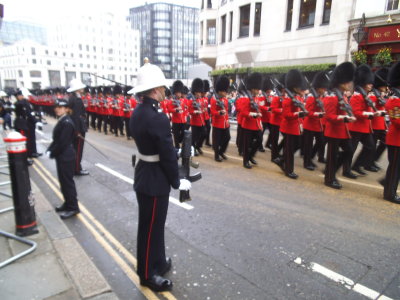The Welsh Guards follow their band