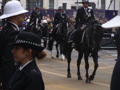 Mounted police follow the guards