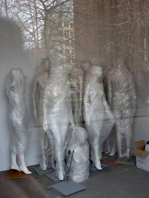 Manikins Caught in a Web between the NYU Library & Student Center Building Reflections