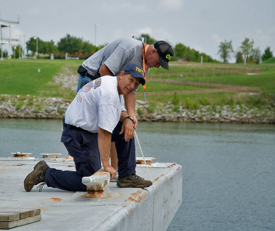 UPDATE: A few hours after these pictures were taken, a body was found under this barge.