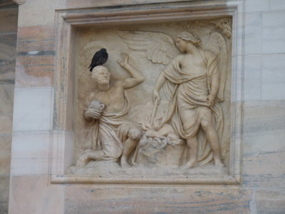 bas relief and pigeon, duomo facade