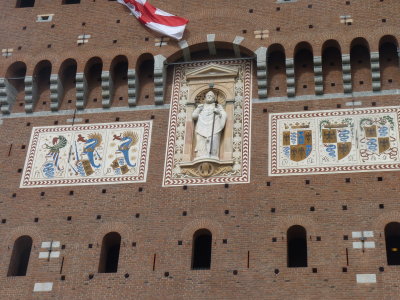 Detail above entrance to Sforzesco Castle, begun by the Viscontis
