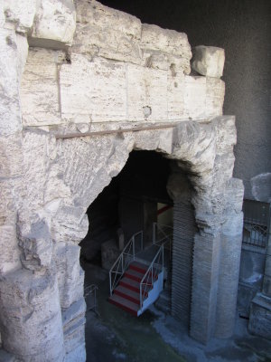 Excavated arch half-way beneath sidewalk level