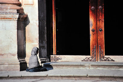 Praying/begging on the steps ofLa Catedral, Oaxaca, Mexico