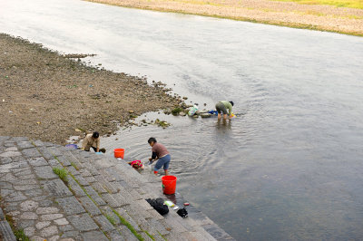Folks use the river to wash their clothes