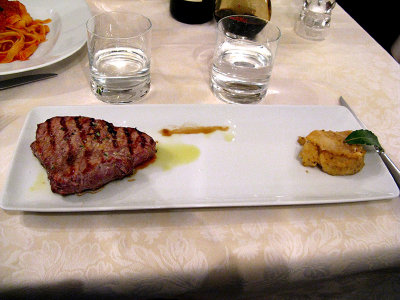 Veal steak  with side of cooked apple with fennel seeds .. 6352