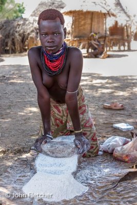Karo Woman Grinding Tef