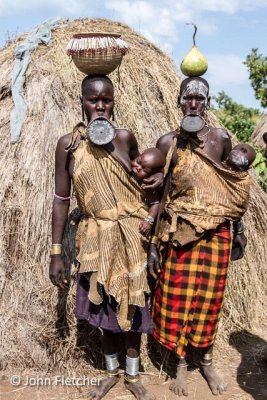 Two Mursi Women with Children