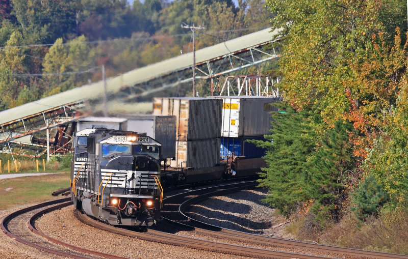 Train 229 is down to 40mph as they swing through  the tight reverse curves at Revilo. 