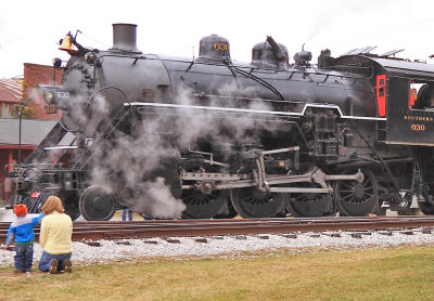 A mother and son watch 630 as it heads for the turntable at Summerville 