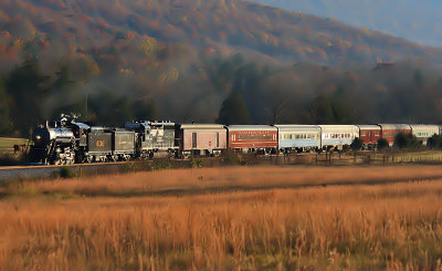 The low evening sun lights up the Northbound excursion train near Cloverdale 