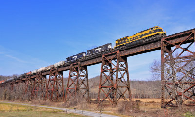 3 Generations of EMD power cross the Green River bridge and start up the hill to Kings Mountain 