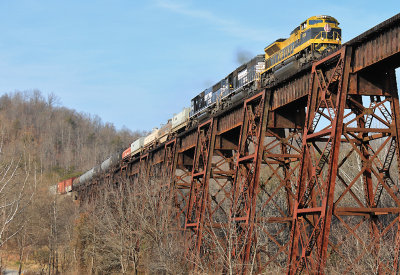 Southbound train 117 charges across the Green River bridge at Southfork 