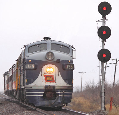 The Eastbound Santa train passes the searchlight signals at Harristown, with the 1189 trailing 