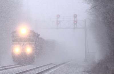 The wind and heavy snow have visibilities down to almost nothing as NS 177 powers through a winters morning at Junction City. 