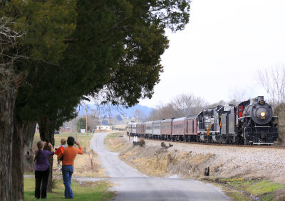 A family is out in the front yard to watch the 630 pass through Mohawk