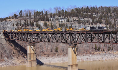 A short 9 car version of the weekly CAT move, NS 055, crosses the Cumberland River on a warm March afternoon 