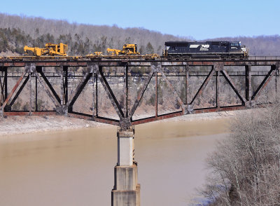A lone EMD brings a CAT High/Wide train over the Cumberland River bridge at Burnside. 