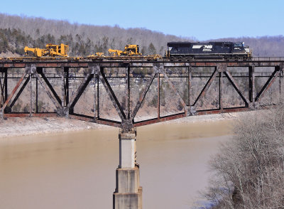 A lone EMD brings a CAT High/Wide train over the Cumberland River bridge at Burnside.