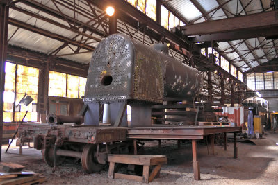 The boiler of K&T #14, a 1944 Alco 0-6-0, under restoration inside the old shop at Stearns 